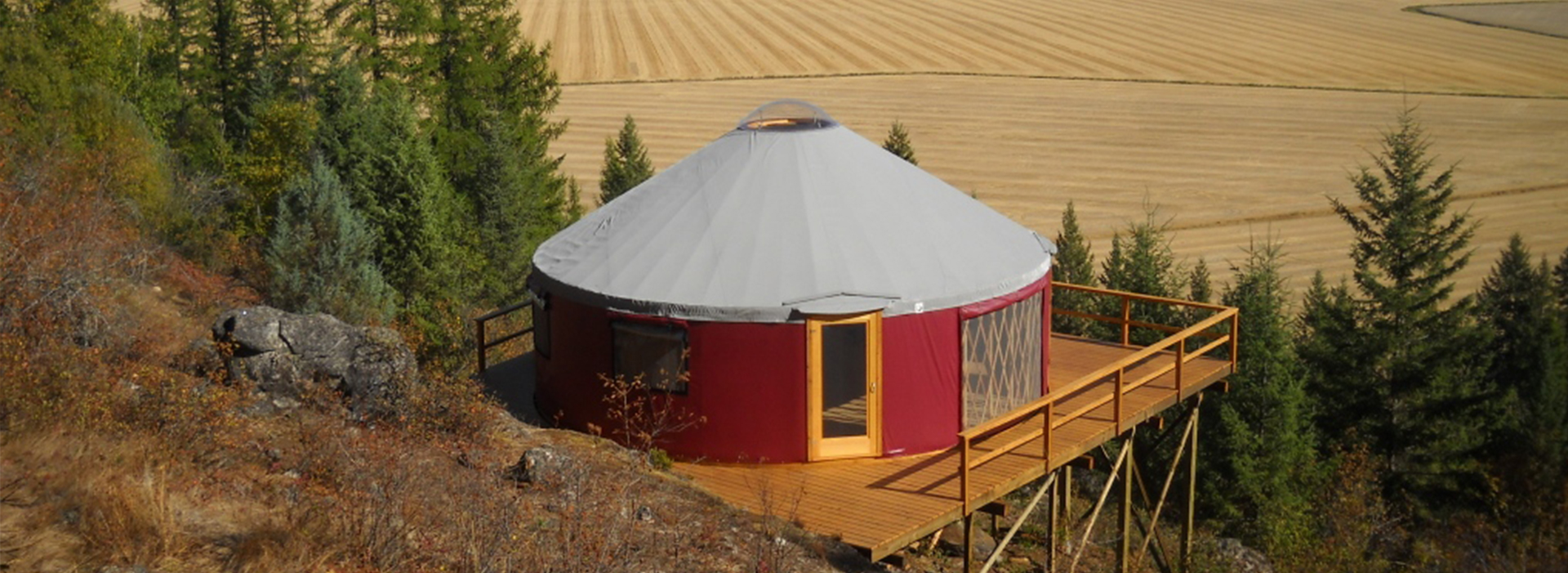 red shelter designs yurt on a platform in flathead valley