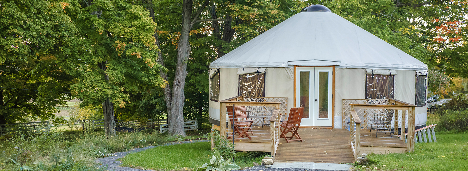 shelter designs yurt with a porch and chairs