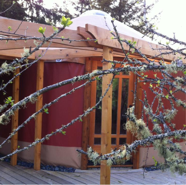 red yurt with an entrance door