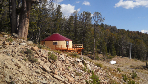 tan yurt with red roof