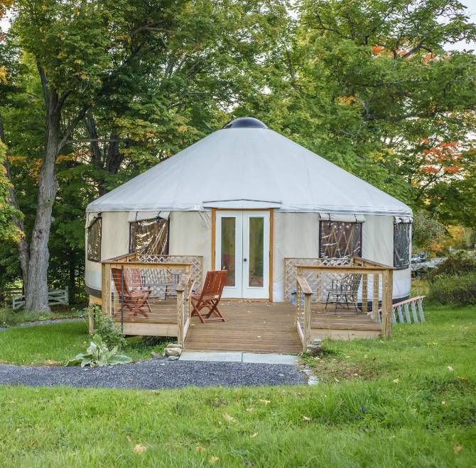 shelter designs yurt with a porch and chairs