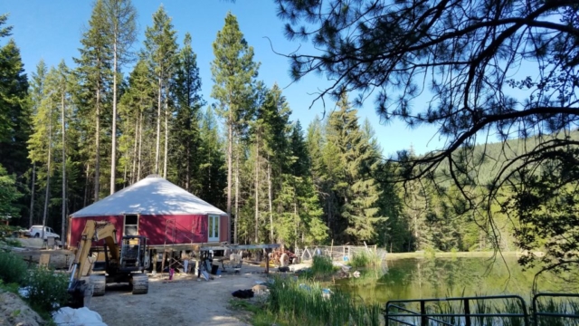 red 40 foot shelter designs yurt on a pond