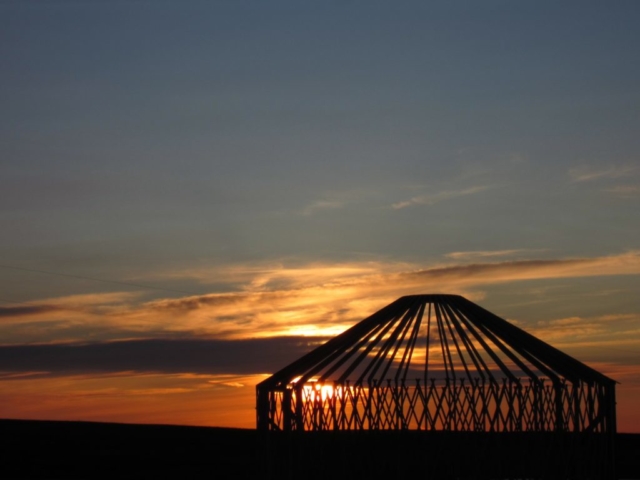 big sky yurt frame against a sunset