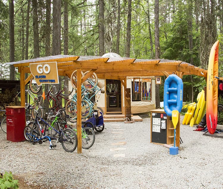 commercial yurt with bikes and rafts in front of it