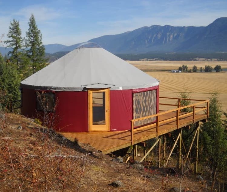 red shelter designs yurt on a platform in flathead valley