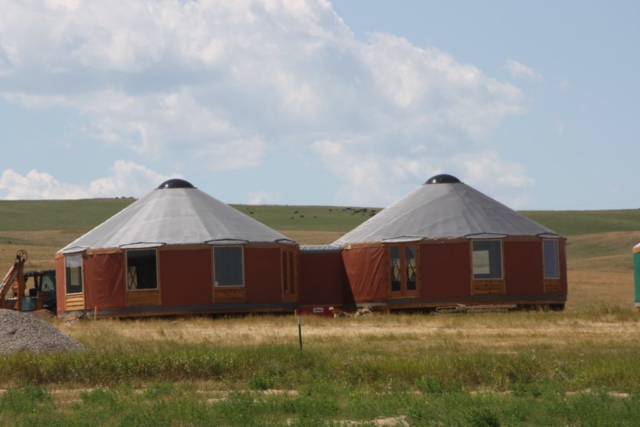 2 red shelter designs yurt with white roofs