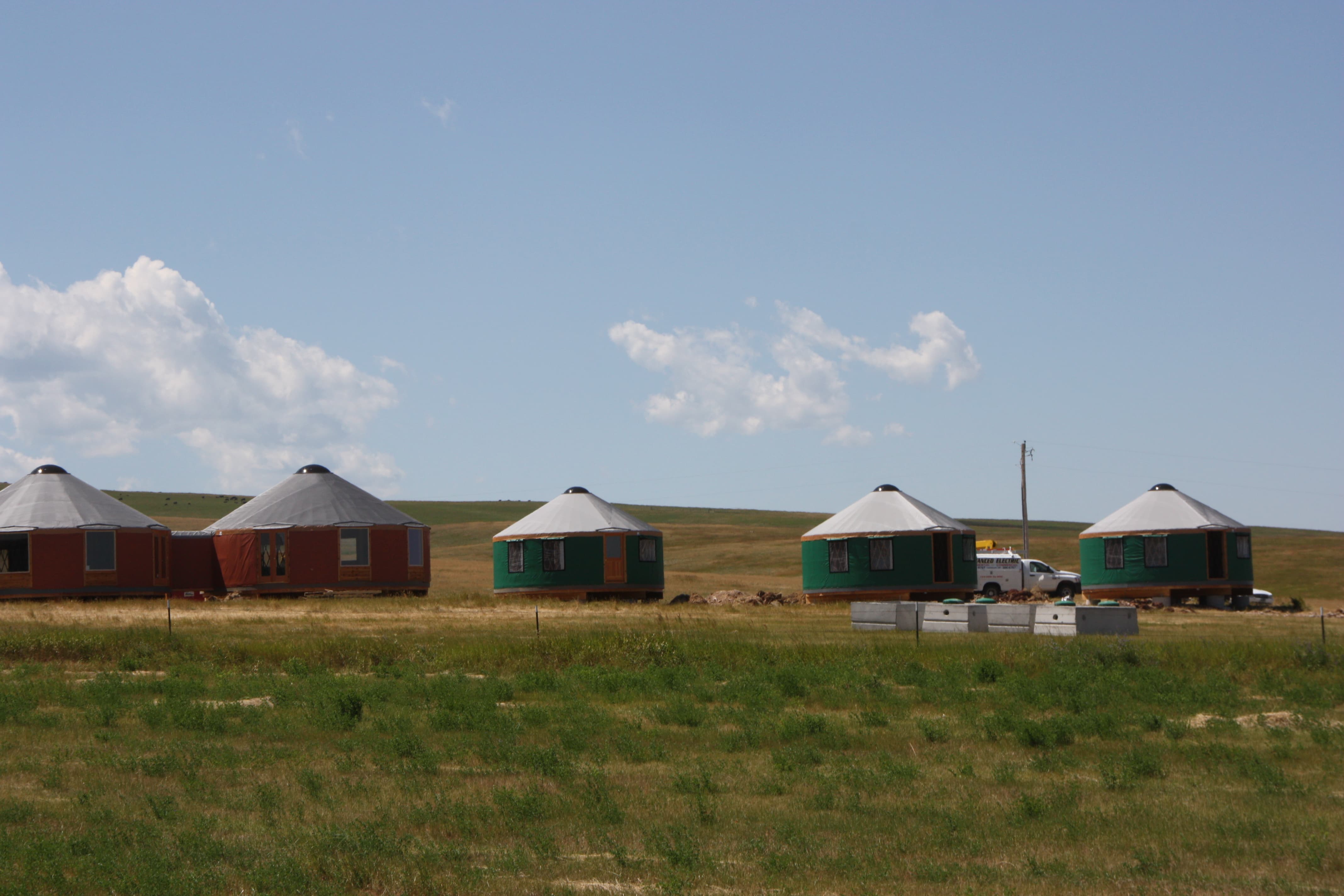 2 red and 3 green yurts
