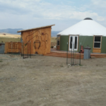 green yurt with french doors