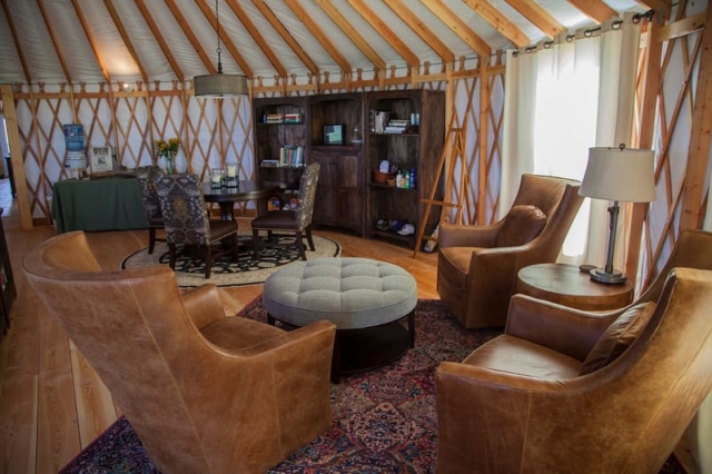 living room and dining room inside a yurt house