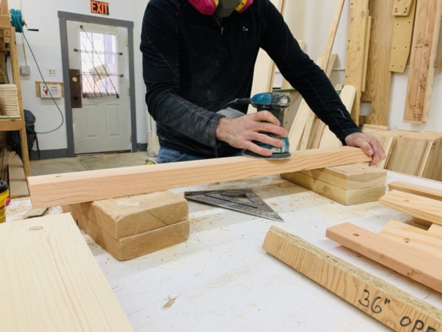 shelter designs employee working on a yurt