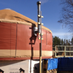 red shelter designs yurt with a stove jack