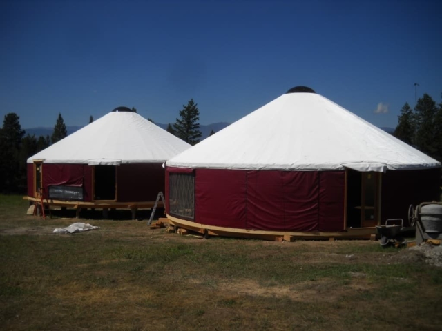 2 red shelter designs yurt with white roofs