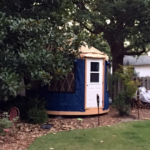 blue shelter designs yurt with a white door