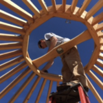 big sky yurt center ring being installed